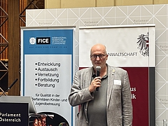 FICE Austria President Christian Posch at the lectern in Palais Epstein, Vienna