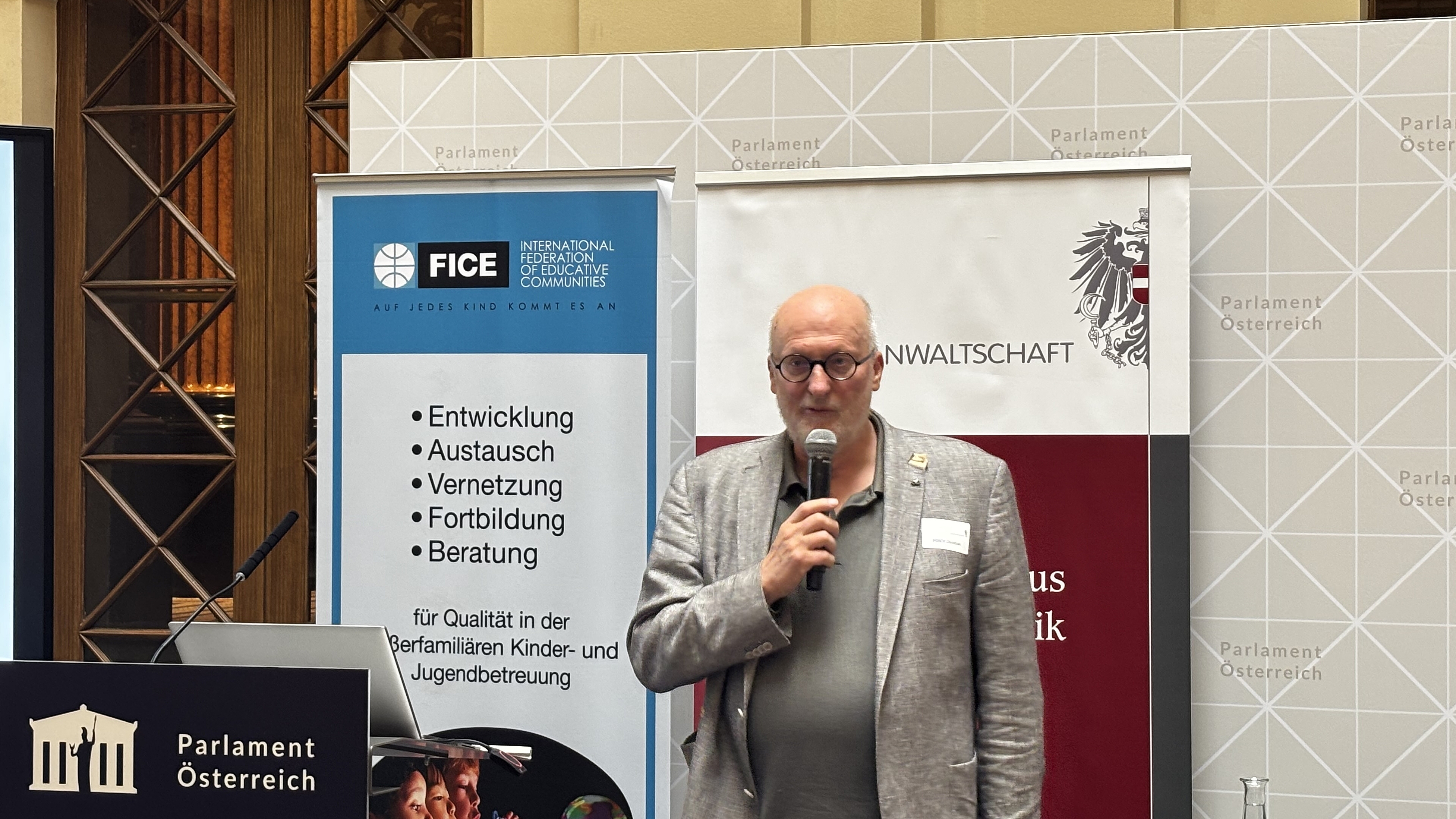 FICE Austria President Christian Posch at the lectern in Palais Epstein, Vienna