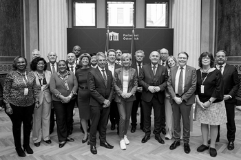 Group of board at the Austrian Parliament, including President of the National Council Sobotka and IOI President Field.